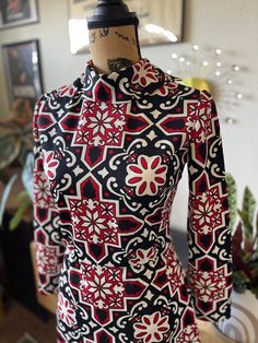 "Adorable vintage 1960s mod mini dress. Long sleeve and turtleneck. Dress has a geometric floral print in white, red, and black. In excellent vintage condition! Measurements  Chest 16\" Waist 13\" Length 36\" Follow our Instagram for reduced pricing on this dress and all of our other items listed! @vintage_envy_and_exotics FREE delivery or pick up in Bay Area (Oakland & SF)" Fitted Mini Dress With Retro Print In 70s Style, Fitted Mini Dress With Retro Print, 70s Inspired, Fitted Retro Mini Dress With Retro Print, Fitted Vintage Print Dress Inspired By 70s, Fitted 70s Inspired Dress With Vintage Print, Fitted Dress With Vintage Print In 70s Style, Red Fitted Retro Mini Dress, Retro Fitted Mini Dress For Fall, Retro Red Fitted Mini Dress