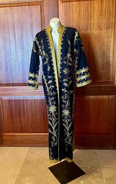 Long boho wool coat with gold embroidery and soutache. Coat is lined and in excellent condition.  Wore it as a Dark Wizard for Halloween. Measures: Shoulders 16" Bust 42"  Length 53" Sleeves 20" Gold Abaya With Gold Embroidery For Festive Occasions, Gold Embroidered Abaya For Festive Occasions, Traditional Gold Outerwear For Winter, Long Sleeve Abaya With Zari Work, Gold Long Sleeve Abaya For Festive Occasion, Winter Outerwear With Gold Embroidery And Long Sleeves, Fall Festive Outerwear With Gold Embroidery, Gold Long Sleeve Kaftan With Zari Work, Festive Fall Outerwear With Gold Embroidery