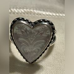 James Avery Sculpted Heart And Tulips White Doublet Sterling Silver Ring, Size 9 Retired Used A Few Times. In Excellent Condition Comes With Dustbag & Box Gift-Able Item Description Item #20158644 From James Avery, This Ring Features: Wear A Bold And Timeless Expression Of Love With This Sterling Silver James Avery Ring Set With A Heart-Shaped Doublet Gemstone. Reminiscent Of Florals Found In Folk Art, Two Tulip Flowers Are Sculpted Onto This Layered, White Stone. * Sterling Silver * White Doubl Classic Heart-shaped White Jewelry, Classic Heart Shaped White Jewelry, Classic White Heart-shaped Jewelry, White Double Heart Classic Jewelry, Classic White Double Heart Jewelry, White Heart Cut Heart Ring For Mother's Day, White Heart Cut Ring For Mother's Day, White Heart Ring For Gift, White Engraved Jewelry For Valentine's Day