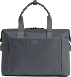 a grey bag with handles and straps on the front, sitting in front of a white background