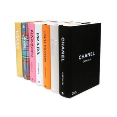 four books are lined up in different colors