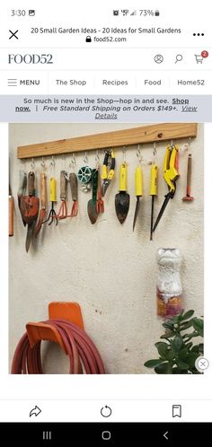 a bunch of garden tools hanging on a wall