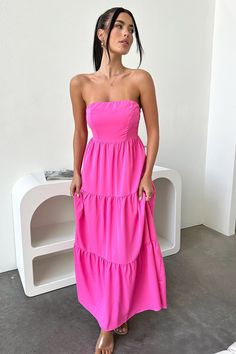 The perfect summer maxi! This gorg babe features a strapless cut, flowy fit, double lining and a shirred back for stretch. Style her with white sandals, little hoops and natural glowy makeup. FABRICATION: 65% Cotton / 35% polyester SIZING: Crystal's height is 162cm and wears a size AU6/US2 Summer Beach Pink Strapless Dress, Pink Strapless Dress For Beach Summer, Chic Pink Strapless Dress For Beach, Strapless Summer Maxi Dress, Chic Pink Strapless Dress For The Beach, Summer Bandeau Strapless Dress For Beach, Strapless Maxi Dress For Spring And Summer, Pink Bandeau Strapless Dress For Beach, Pink Bandeau Dress For Beach