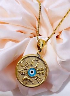 Evil Eye Necklace, Evil Eye Protection Necklace, Evil Eye Pendant Necklace, Protection Handmade Jewelry, 18K Gold Filled Necklace. ❄️Our Small Round Evil Eye pendant features a glass-style stone with a high polish finish. This lovely necklace is perfectly suited for you. The simple 18k gold evil eye jewelry makes an elegant addition to the fine jewelry collection of any woman. ❄️Our Gold Filled is made with 3%(1/30) gold content using 18Kt. The base metal for this type of jewelry is brass. Gold Gold Evil Eye Jewelry, Round Evil Eye, Hypoallergenic Necklace, Necklace Evil Eye, Eye Pendant Necklace, Evil Eye Protection, Gold Filled Necklace, Protection Necklace, Glass Style