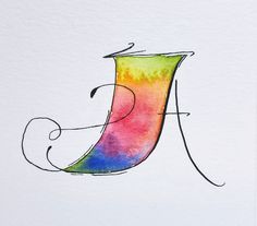 the letter j is painted with watercolors and has a swirly design on it