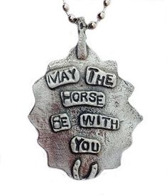 "May the Horse Be With You!" Lead-free pewter and turquoise resin sunburst. Comes on 18" stainless steel ball chain and measures approximately 1.5" wide by 2" high. Inspirational Nickel-free Metal Jewelry, Inspirational Nickel-free Silver Necklace, Nickel-free Metal Inspirational Jewelry, Nickel-free Meaningful Silver Necklace, Meaningful Silver Nickel-free Necklaces, Nickel-free Silver Necklace With Meaningful Style, Silver Hand Stamped Metal Necklace, Handmade Inspirational Silver Jewelry, Inspirational Handmade Silver Jewelry