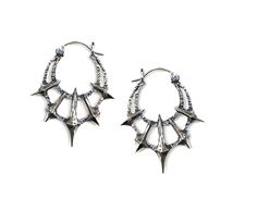 Add some gothic style to your wardrobe with these unique Chaos Earrings. Made in sterling silver, these earrings feature 5 spikes contrasted by a heavy textured crescent. Dimensions These earrings are 45mm long x 36mm wide and 5mm thick Each earring weighs approximately 6.5grams Edgy Handmade Silver Earrings, Edgy Silver Jewelry With Spikes, Silver Punk Jewelry With Spikes, Gothic Silver Earrings With Oxidized Finish, Gothic Oxidized Metal Earrings, Silver Gothic Plug Earrings For Festival, Edgy Silver Sterling Silver Plug Earrings, Edgy Sterling Silver Plug Earrings, Punk Style Sterling Silver Pierced Earrings