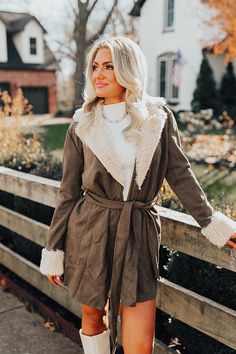 Belted Long Sleeve Fur Coat For Fall, Fall Faux Fur Belted Outerwear, Beige Winter Outerwear With Belted Cuffs, Winter Faux Fur Belted Outerwear, Winter Faux Fur Belted Coat, Winter Belted Faux Fur Coat, Belted Faux Fur Coat For Winter, Chic Belted Faux Fur Outerwear, Martini Olive