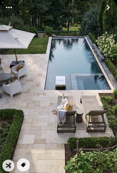 an aerial view of a pool and patio area