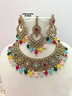 Antique Gold Polki Necklace Set comes with earrings and tikka / Indian Jewelry/ High Quality Kundan and Polki Jewelry/ Bollywood Jewelry/Wedding Jewelry/multi color All items are shipped from Brampton, Ontario, Canada. If you need your item by a certain day, please reach out to us for express delivery option before placing the order so that we can update the shipping for you. Standard shipping/delivery timeline Below are the delivery timeline estimates once the order ia shipped ---> USA delivery timeline * 3-5 business days to major urban centers in USA. It may take 1-2 days extra to remote locations ---> Canada delivery timeline  * 2-3 business days - GTA  & Montreal  * 2-4  business days - Rest of Ontario/Quebec * 3-6 business days-  Rest of Canada    ---> Europe/Middle East timeline * 5 Luxury Bollywood Style Multicolor Necklace, Luxury Multicolor Bollywood Style Necklaces, Luxury Bollywood Multicolor Jewelry Sets, Luxury Multicolor Bollywood Necklace, Luxury Multicolor Meenakari Jewelry Sets, Luxury Multicolor Meenakari Bridal Necklace, Luxury Bollywood Multicolor Necklace, Luxury Multicolor Jewelry Sets For Diwali, Luxury Multicolor Bollywood Jewelry Sets