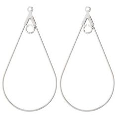 pair of silver earrings with tear shaped hoops on white background stock photo - premium royaltying