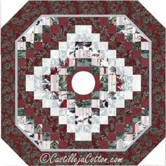 a red and white quilted table topper with a circular design on the center