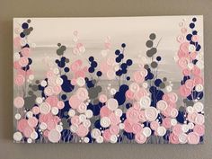 a painting with pink and white flowers on the bottom half of it, in front of a gray wall