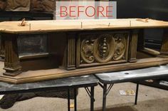 a large wooden table sitting on top of a floor next to a fire place in a fireplace