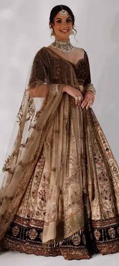 Beige and Brown color Lehenga in Silk fabric with Embroidered, Sequence, Thread work Brown Dupatta With Intricate Embroidery, Unstitched Wedding Sets With Motifs, Floor-length Anarkali Set With Motifs For Wedding, Brown Wedding Dress For Eid, Wedding Sets With Motifs And Floor-length Design, Wedding Sets With Motifs In Floor-length, Floor-length Wedding Sets With Motifs, Anarkali Wedding Dress With Motifs, Bollywood Style Wedding Sets With Motifs