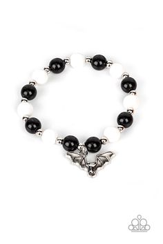 Bracelets in assorted shapes and colors. Accented with the ghoulish charm of a bat, the stretchy bracelet is in a black and white beads with silver accents.

Sold as one kid's bracelet. Edgy Bracelets, Emo Jewelry, Diy Kandi Bracelets, Jelly Purse, Diy Kandi, Dark Jewelry, Writing Tattoos, Edgy Jewelry, Kandi Bracelets