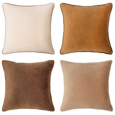 four different colored pillows on a white background, one is brown and the other is beige