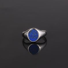 The Lapis Lazuli Ring. An Oval Royal Blue Stone encompassed by a 18k Gold Signet completed with a polished finish. No two rings are the same, the natural stone has a mixture of Gold, white & blues perfectly complimenting the Gold ring & a great ring to pair with the Lapis lazuli Pendant. Also available in Black Onyx (Real stone) & Green Opal (Lab Created). Unisex Ring, womens sizes available! DETAILS  Materials: Stainless Steel (Base) & 18K Gold PVD Plating.  Hypoallergenic / No tarnishing / No Formal Stainless Steel Round Band Jewelry, Minimalist Oval Stainless Steel Jewelry, Blue Minimalist Jewelry With Polished Finish, Minimalist Blue Jewelry With Polished Finish, Blue Polished Open Ring Jewelry, Blue Open Ring Jewelry With Polished Finish, Blue Polished Finish Open Ring Jewelry, Minimalist Blue Ring With Polished Finish, Blue Jewelry With Polished Finish Round Band