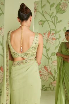 Pistachio green georgette saree with embroidered bead and sequin work. Paired with an embroidered blouse.
Component: 2
Pattern: Embroidered
Type Of Work: Bead work, Cutdana work, Sequins
Neckline: V neck
Sleeve Type: Sleeveless
Fabric: Georgette
Color: Green
Other Details: 
Sheer saree
Occasion: Reception - Aza Fashions Sheer Saree, Green Georgette Saree, Cutdana Work, Pure Georgette Sarees, Floral Print Sarees, Floral Saree, Embroidered Saree, Green Saree, Net Saree