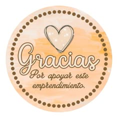 a round sign with the words gracias and a heart in spanish on it