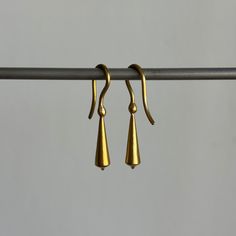 Stately everyday earrings that unite form with fluidity. 22k yellow gold Tapered pod is 5mm x 18mm (3/16" x 3/4")Earrings hang 1 3/16" from the earEach earring weighs 2.4g Classic 22k Gold Earrings, Elegant Recycled Gold Earrings With Ear Wire, Hand Forged Long Drop Modern Earrings, Hand Forged 14k Gold Minimalist Earrings, Modern Formal Earrings In Recycled Gold, Minimalist Teardrop Earrings In Recycled Gold, Modern Recycled Gold Earrings For Formal Occasions, Modern Recycled Gold Earrings For Formal Events, Yellow Gold Teardrop Linear Earrings For Pierced Ears