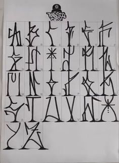 an old fashioned type of alphabet with numbers and letters drawn in black ink on white paper