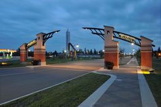 the entrance to an empty parking lot at night