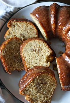 a white plate topped with bundt cakes covered in frosting