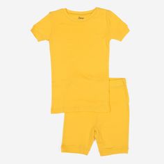 Summertime is also perfect for comfy sleepwear, and these Kids Two Piece Cotton Short Pajamas provide wearers with a fashionable look they deserve. Products come with a short sleeved shirt and breathable shorts, both having an overall cool feeling for the warmer nights. The bottoms implement an elastic waistband to provide a loose feeling for your little one, while the tagless labels ensure a scratch-free experience. Pajamas come in solid colors ranging from black, aqua, and so many others to ea Solid Short Sleeve Bedtime Sets, Solid Color Short Sleeve Sleepwear For Pajama Party, Comfortable Solid Color Short Sleeve Sets, Comfortable Solid Short Sleeve Sets, Cotton Bedtime Sets In Solid Color, Solid Cotton Sleepwear For Sleepover, Casual Short Sleeve Playwear Set, Cotton Short Sleeve Sleepover Set, Short Sleeve Cotton Sleepover Set