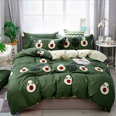 an image of a bedroom setting with green comforter and matching pillowcases on the bed