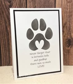 a card with an image of a dog's paw and the words, never forget that in between hello and goodbye there was so much love