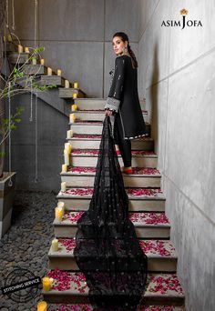 FABRIC: LAWNCOLOR: BLACK PRODUCT DETAILS Eloquently beautiful Iqra Aziz slays in this black attire. A noir lawn base is decked with stunning off white threadwork uplifted by heavy 9mm sequins giving it a tribal feel. It’s complemented by a diaphanous heavily embroidered chiffon dupatta and plain dyed cotton trouser.DESIGN DETAILS:1.25 meters Embroidered Front on lawn1.25 meters Plain dyed lawn for back0.75 meters Embroidered Sleeves with border on lawn2.5 meters Embroidered Dupatta on chiffon (i Wedding Black Unstitched Suit With Chikankari Embroidery, Black Wedding Unstitched Suit With Chikankari Embroidery, Formal Black Unstitched Suit With Chikankari Embroidery, Black Unstitched Wedding Suit With Chikankari Embroidery, Black Chikankari Embroidery Unstitched Suit For Wedding, Elegant Black Unstitched Suit With Naqshi Detail, Formal Black Sets With Chikankari Embroidery, Designer Black Dress With Chikankari Embroidery, Black Chikankari Embroidery Designer Dress