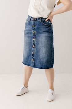 The perfect combination of vintage and feminine - the 'Hilda' denim skirt walked straight out of the 90's into your closet! A distressed denim skirt is one of our favorite staple pieces and the details on this one are exceptional! Quality no stretch denim, a slight A-line style, functioning pockets, brass buttons, and a raw hem. Easily transitional; you can wear it with sandals and your favorite tee for the summer or pair it with a sweater and boots for the fall! Exclusively designed by us for y Classic High Waist Denim Skirt In Blue, Classic Mid-rise Denim Blue Denim Skirt, High Waist Medium Wash Relaxed Denim Skirt, High Waist Relaxed Fit Medium Wash Denim Skirt, High Waist Relaxed Medium Wash Denim Skirt, Relaxed Fit Denim Skirt For Everyday, Classic Mid-rise Denim Blue Skirt, Fall Dark Wash Washed Denim Skirt, Mid-rise Washed Denim Blue Skirt