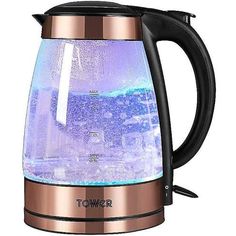 an electric kettle filled with water on top of a white background and the words tower above it