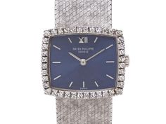 Blue dial with baton hour markers, diamond set bezel, textured milanese bracelet, in 18k white gold. Dial and clasp signed Patek Philippe. Minor wear to crystal at 11 o'clock. Diamond Watches Women, Jewellery Marketing, Diamond Watch, Patek Philippe, Clock, Gems, White Gold, Texture, Crystals