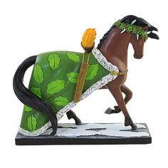 a figurine of a horse with a green blanket on it's back