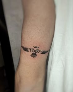 a person with a tattoo on their arm