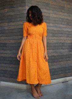 "Orange hand block print maxi dress, Button down dress, Custom made, Made to order, Plus size This linen dress is perfect for the ongoing Autumn. -Model height: 5'3\" wearing size S -Length: 46\" -Fit: Comfortable -100% Cotton Hand block printing is one of the oldest techniques used in India. **Note: Free Shipping time 15-21 days. Express Shipping time 5-7 days.**" Bohemian Cotton Midi Dress With Buttons, Cotton Midi Dress With Buttons For Casual Wear, Cotton Sundress With Buttons, Cotton Midi Sundress With Buttons, Yellow Cotton Button-up Dress, Yellow Button-up Cotton Dress, Orange Cotton Dresses With Printed Motifs, Cotton Maxi Dress With Buttons For Casual Wear, Block Print Fitted Maxi Dress