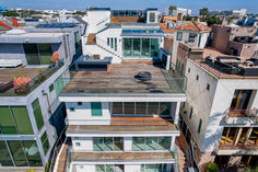 an aerial view of several multi - story buildings with balconies on the roof