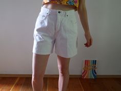 "White wash denim shorts really make a Summer tan pop! Color: White Fabric: 100% cotton on stretch denim Brand: Navy Blue Clothing Company (estimated 1990s era vintage retro jean shorts) Bermuda length Zipper and Single Button Closure Flaws: some wear on the inside thigh seam - item is in good vintage condition for an estimated 90s era piece. About the Fit: Model is 5,7\" and usually wears a modern women's size S - M / 28 / US 4 - 6. The shorts are tight on the model please see the measurements Y2k High Waist Cotton Shorts, Y2k Style Cotton Shorts For Spring, Spring Y2k Style Cotton Shorts, Spring Y2k Cotton Shorts, Fitted Cotton Knee-length Jean Shorts, Y2k High Rise Cotton Shorts, Fitted Knee-length Cotton Jean Shorts, Y2k Style White Bottoms Short Length, Y2k Style White Short Bottoms