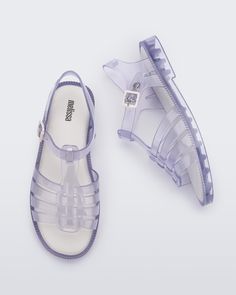 Step into the Melissa Possession Fresh, a new take on the beloved original jelly. With an open toe for a breezier feel, it retains the iconic fisherman-style upper and adjustable buckle. Lightweight, versatile, and 100% recyclable, it embraces timeless Melissa style with a more traditional sandal silhouette. Spring Clear Closed-toe Jelly Sandals, Spring Clear Closed Toe Jelly Sandals, Clear Closed Toe Jelly Sandals For Spring, Casual Jelly Sandals With Clear Strap, Adjustable Jelly Sandals With Buckle Closure, Casual Flat Jelly Sandals With Clear Strap, Casual Clear Sandals For Spring, Casual Transparent Sandals For Spring, Casual Clear Jelly Sandals