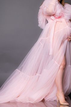 Sheer Maternity Robe, Photoshoot Robe, Pink Sheer Robe Tulle transparent soft pink robe with tulle ruffles can be used for the boudoir photoshoots not only maternity, but non-maternity. Sleeves are decorated with pearl buttons Robe can be used for maternity or non maternity pictures for XS -XL sizes After payment is received gown will be ready to ship in 5-7 business days. I provide worldwide shipping. All items are shipped with registered mail (terms are stated not guaranteed) Orders within USA Pink Fitted Sheer Gown, Pink Fitted Gown With Sheer Details, Pink Fitted Robe For Wedding Night, Sheer Pink Dress For Wedding, Feminine Pink Tulle Gown, Ethereal Sheer Tulle Gown, Pink Tulle Maternity Dress For Wedding, Pink Fitted Gown For Wedding Night, Floor-length Pink Gown For Wedding Night