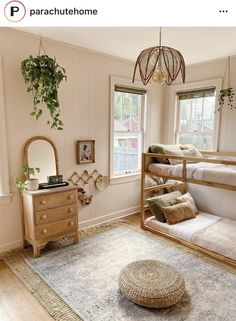 a bedroom with two bunk beds and a rug on the floor