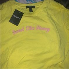 A Bright Yellow T-Shirt With Pink Writing. Never Worn. Brand New With Tag. Trendy Yellow Top With Text Print, Neon Yellow Cotton T-shirt For Spring, Spring Yellow Shirt With Letter Print, Cute Yellow Tops With Text Print, Cute Yellow Text Print Top, Yellow Graphic Tee Shirt With Text Print, Yellow Graphic Tee With Text Print, Forever 21 Yellow Cotton Top, Trendy Yellow Forever 21 Tops