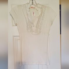 Nwt Strut Do & Be; Cream Colored; Medium (But See Last Pic - I'm A Size Small, 4, & This Fits Snug); Beautiful Blouse W/Lace On Top Half; 2 Buttons Are Sewn Shut; Only Worn To Try On; Perfect Condition; Can Be Worn Casual W/Jeans/Shorts, Or Dressed Up W/A Skirt - Very Versatile. (Btw.. In The Last Pic - The Black Is On The Mirror, Not The Shirt! So Sorry!) Stored In Pet Free, Smoke Free Environment; Any Questions? Just Let Me Know! Fitted Lace Top T-shirt For Spring, Casual Fitted Tops With Lace Trim, Fitted Casual Tops With Lace Trim, Stretch Lace Trim Short Sleeve Blouse, Casual Fitted Lace Trim Top, Fitted Cotton Shirt With Lace Trim, Casual Stretch Blouse With Lace Trim, Fitted Lace Trim T-shirt For Summer, Fitted Lace Trim Shirt For Spring