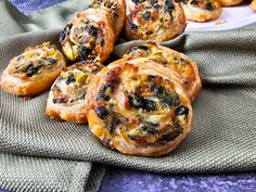 several pastries sitting on top of a cloth