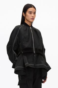 The bomber jacket is reimagined with feminine flair. Cut in an Italian viscose cotton blend, the underlayer drapes into an alluring handkerchief hem. Soft pleats around the neck line are gathered into contrast rib. Double closure, with zipper side details. Boxy fit. 60% Cotton 37% Viscose 3% Elastane Model is 5'10', Bust: 30', Waist: 23', Hips: 34' and wearing a size Small Professional dry clean only Black Layers, Perfect Pant, Handkerchief Hem, Long Sleeves Coats, 3.1 Phillip Lim, Women Trends, Short Jacket, Cotton Jacket, Phillip Lim