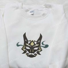 Xiao Yaksha Mask Embroidered Sweatshirt, Video Game Characters Embroidered Hoodie, Best Gift Ideas For Family Tinicloset is a realm of sartorial artistry, where every garment is a canvas and every stitch a brushstroke, weaving stories of individuality and creativity. Nestled in the heart of fashion, our store stands as a testament to the exquisite craft... White Sweatshirt With Machine Embroidery For Streetwear, White Hooded Top With Machine Embroidery, Winter Streetwear Top With Machine Embroidery, Long Sleeve Hoodie With Embroidery For Streetwear, Long Sleeve Hoodie With Machine Embroidery For Streetwear, White Hooded Top With Custom Embroidery, White Hooded Top With Embroidered Graphics, White Embroidered Hooded Hoodie, Long Sleeve Sweatshirt With Machine Embroidery For Streetwear