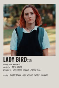 a woman with red hair is standing in front of a poster for the movie lady bird