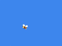 two bees are flying in the blue sky